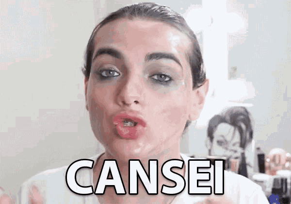 a woman is making a funny face with the word cansei written on her face