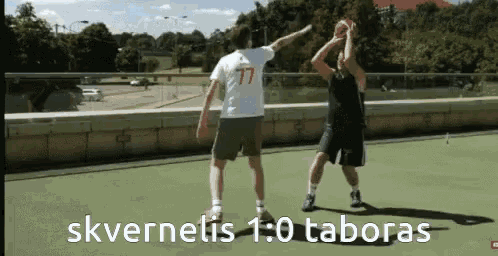 two men are playing basketball and one has the number 77 on his jersey