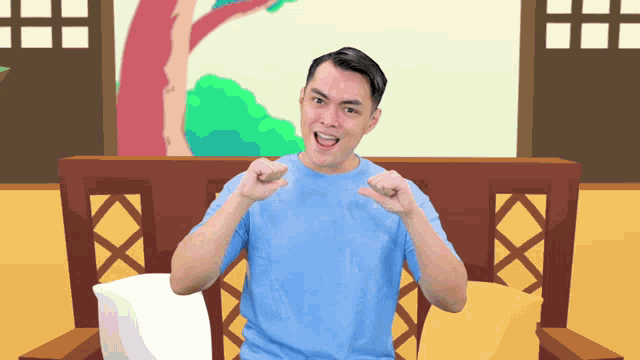 a man in a blue shirt is sitting on a couch and making a funny face