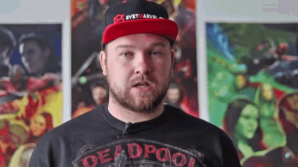 a man with a beard wearing a deadpool shirt