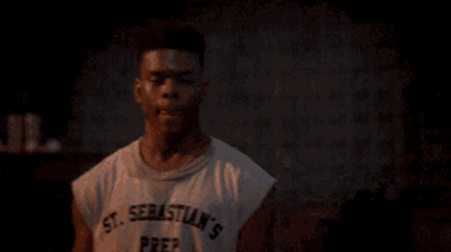 a man wearing a st sebastian 's prep shirt