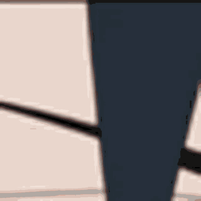 a close up of a black leg on a table with drawers .