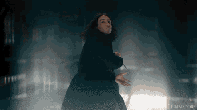 a man in a black coat is holding a wand in front of a dumbledore sign