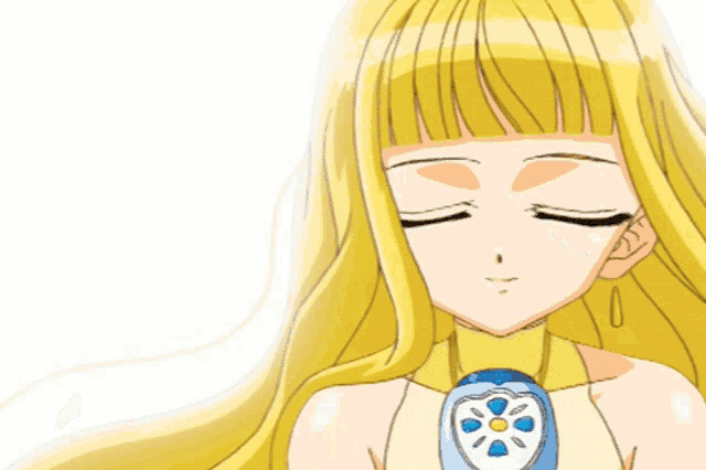 a girl with long blonde hair is smiling and wearing a necklace with a flower on it