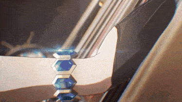 a close up of a person wearing a bracelet with blue beads
