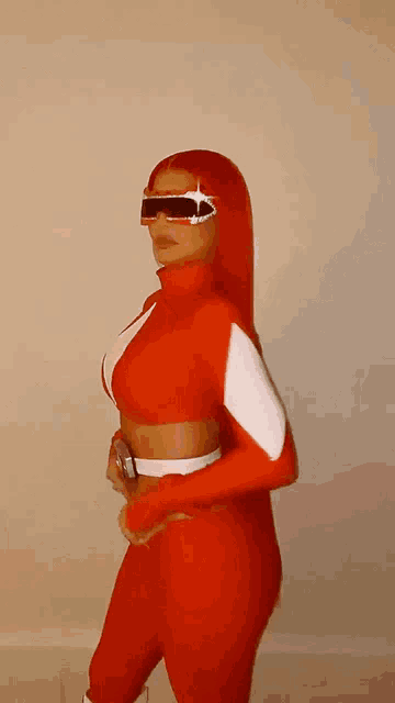 a woman with red hair is wearing a red and white costume and sunglasses