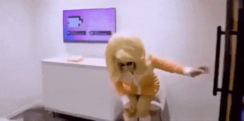 a person in a costume is standing in front of a refrigerator in a room .
