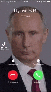 a man in a suit and tie is taking a call on a phone .