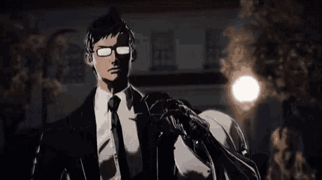 a man in a suit and tie with a robotic arm .