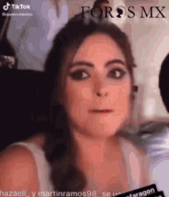 a close up of a woman 's face with the words foros mx visible