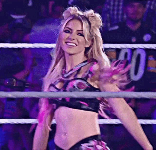 a woman in a wrestling ring with the number 20 on the back