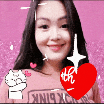 a woman wearing a shirt that says ' pink ' on it is smiling