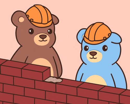 two teddy bears wearing hard hats are standing next to each other on a brick wall