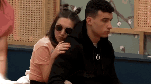 a man and a woman are sitting next to each other