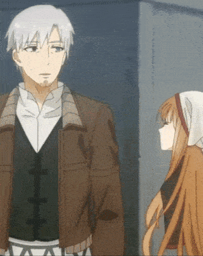 a man and a girl are standing next to each other and the girl is wearing a head scarf