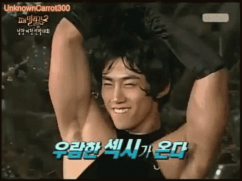 a man with his arms outstretched is smiling and making a face .