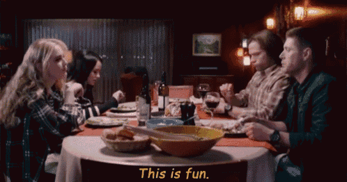 a group of people are sitting around a table with the words " this is fun " written in yellow