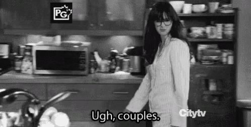 a black and white photo of a woman in a kitchen with the words `` ugh , couples '' .