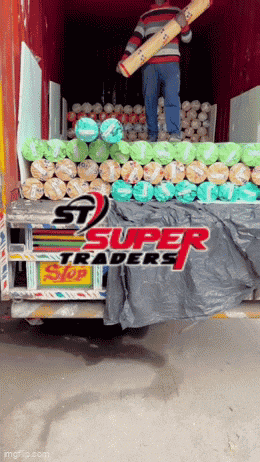 a super traders truck with a man holding a rug