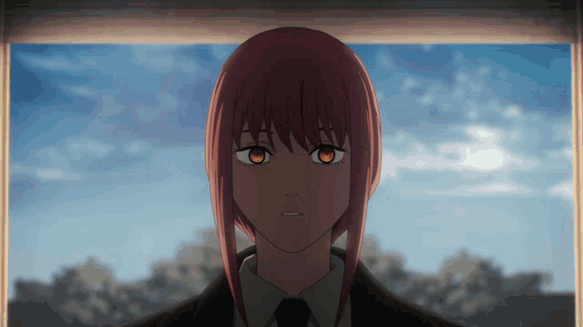 a woman with red hair and orange eyes is looking out a window