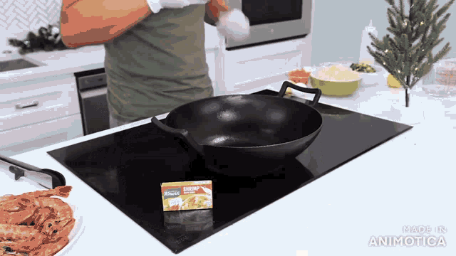 a box of knorr sits next to a wok