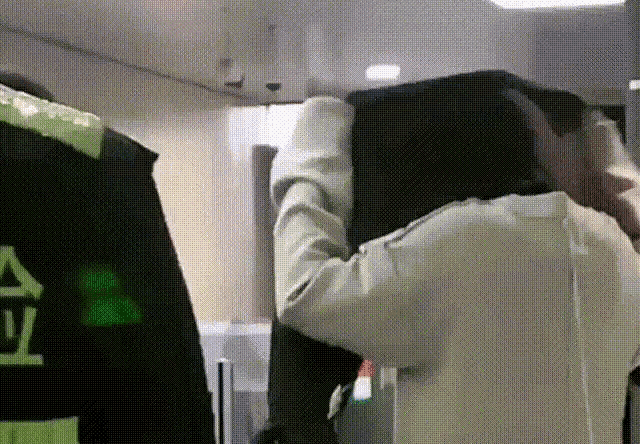 a person wearing a jacket that says ' a ' on it