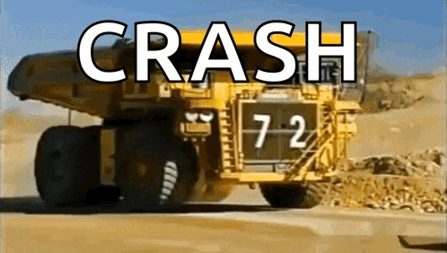 a yellow dump truck with the number 72 on the side of it