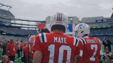 a football player wearing a red jersey with the name maye on the back