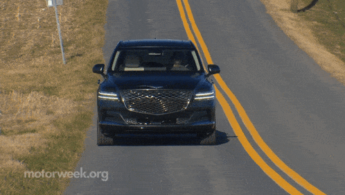 a car is driving down a road with motorweek.org written on the bottom right