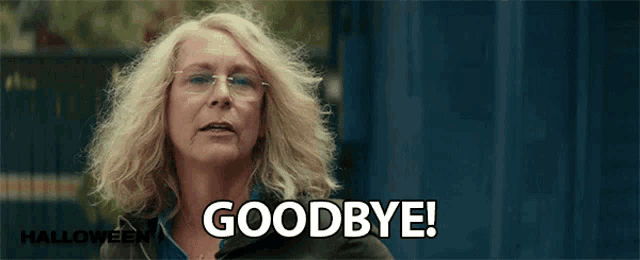 a woman with blonde hair and glasses is saying goodbye