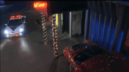 a spd car is parked in front of a building