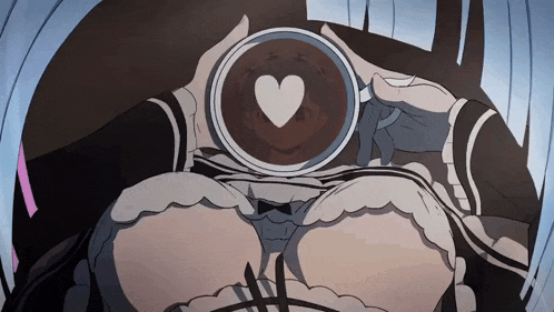 a woman is holding a cup of coffee with a heart in it