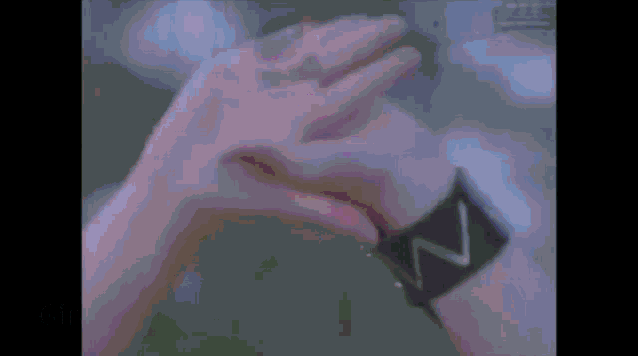 a close up of a person 's wrist with a watch that says n on it