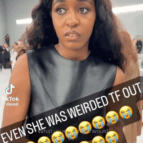 a woman in a black leather dress with a caption that says " even she was weirded tf out " on it