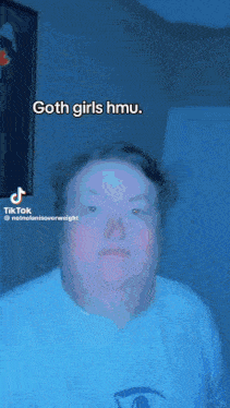 a man in a white shirt says goth girls hmu .