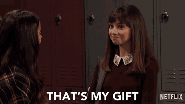 a girl talking to another girl with the words that 's my gift on the bottom right
