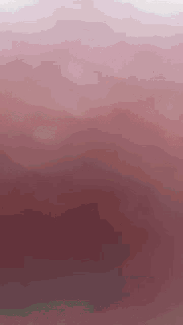 it looks like a painting of a sunset with a gradient of pink .