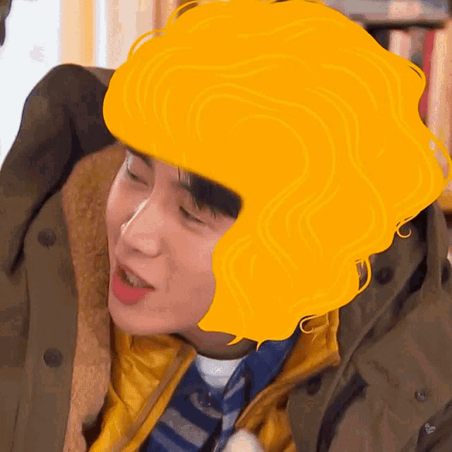a man wearing a jacket and a yellow hat has a yellow wig on his head .