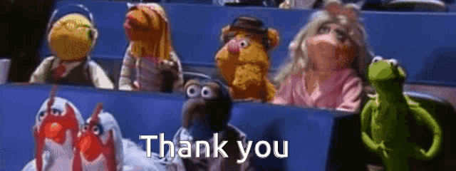 a group of muppets are sitting in a row and saying thank you