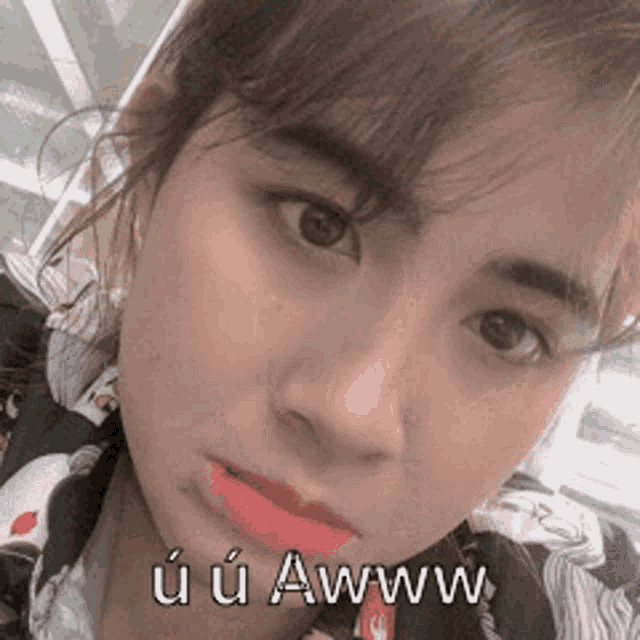 a close up of a woman 's face with the words u u awww written on the bottom