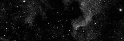 a black and white photo of a galaxy with lots of stars