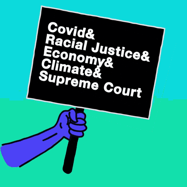 a hand holding a sign that says covid racial justice economy climate & supreme court
