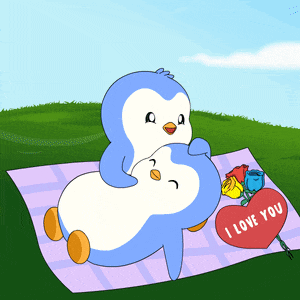 a couple of penguins laying on a blanket with a red heart that says i love you