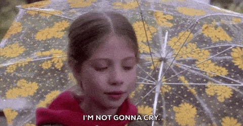 a girl is holding an umbrella and saying i 'm not gonna cry