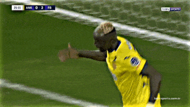 a soccer player wearing a yellow jersey that says portas