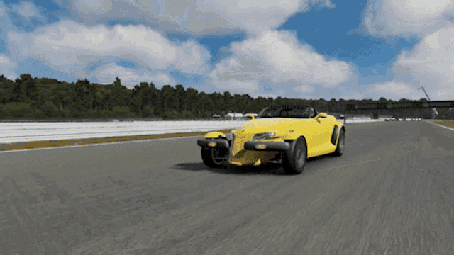 a yellow sports car is driving on a track with a license plate that says ' jcw ' on it