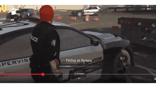 a police officer is putting on a harness in a video game