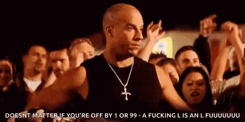 vin diesel is standing in front of a crowd of people in a crowded room .