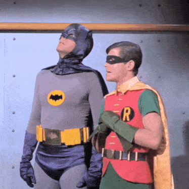 a man in a batman costume and a man in a robin costume