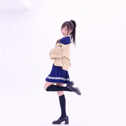 a girl wearing knee high socks and black shoes